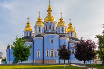 Fototapeta na wymiar St. Michael's Golden-Domed Monastery sparkles with its domes in sunshine. Kiev. Ukraine