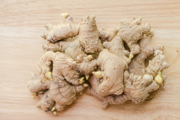 Close up ginger on wooden background