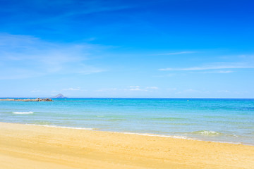 European sandy beach and blue sea.