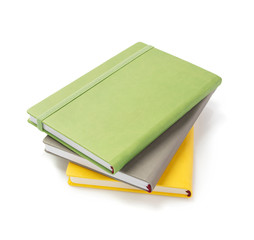 notebook and pad at white background