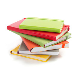 notebook and pad at white background