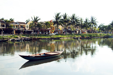 Hoi An ancient old town with boat and river