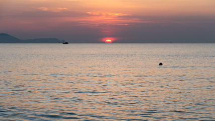 Sun rising on the horizon