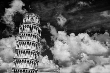 The famous Leaning Tower of Pisa among beautiful clouds (Black and White)