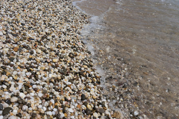 Natural background of small colored pebbles