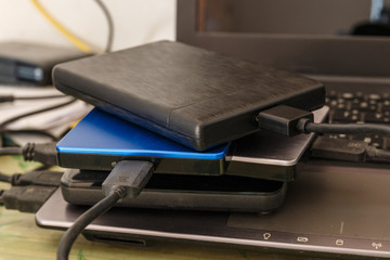 External disk hard drive connected to notebook for backup from computer data