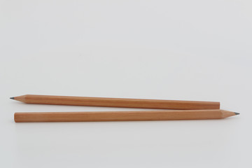 Two Brown pencil with sharp concept different ,Isolated on a White Background.