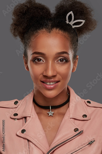 A Close Up Portrait Of A Young African Lady With Double Bun