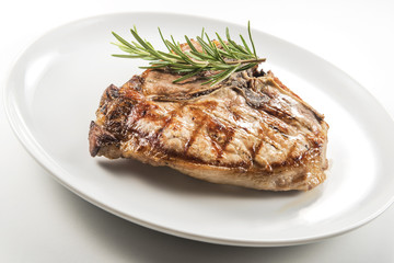 Grilled t-bone chop of pork