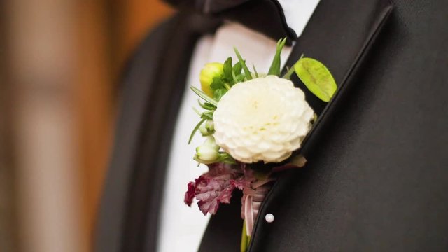 Mans button hole in wedding suit