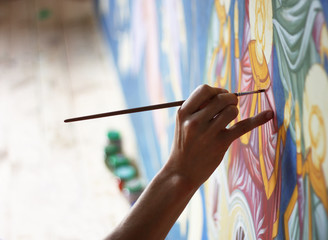 artist's hand, painting on canvas