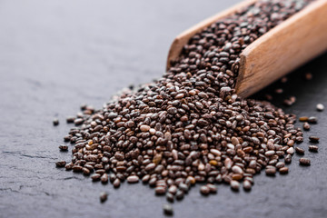 chia seeds on a dark stone background