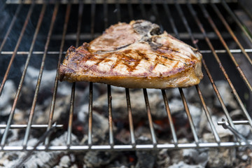 T-bone chop of pork on the grill