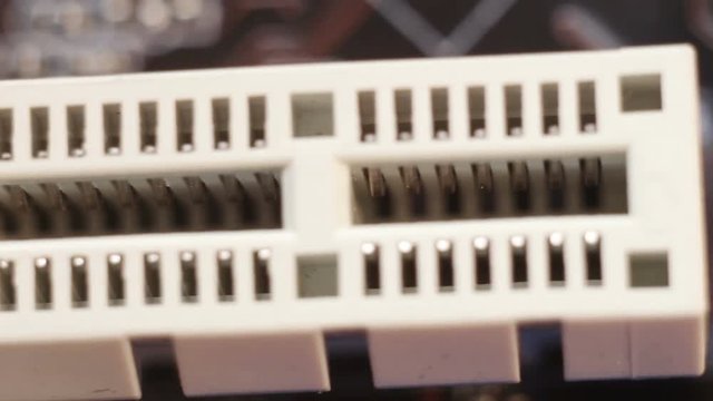 Ram soket on motherboard, selective focus with shallow depth of field. Electronic technology background.
