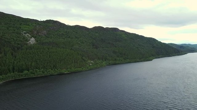 Loch Ness aerial - slow pan left to right - Urquhart Castle in background