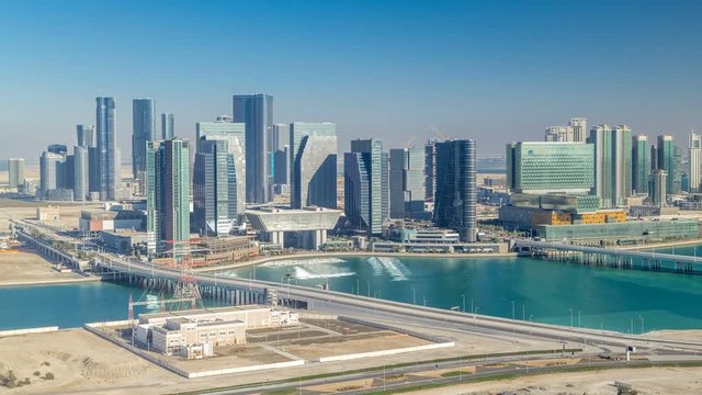 Aerial skyline of Abu Dhabi city centre from above timelapse