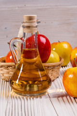 apple vinegar on a wooden rustic background