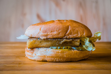 Delicious and juicy burger with appetizing meatball and fresh vegetables