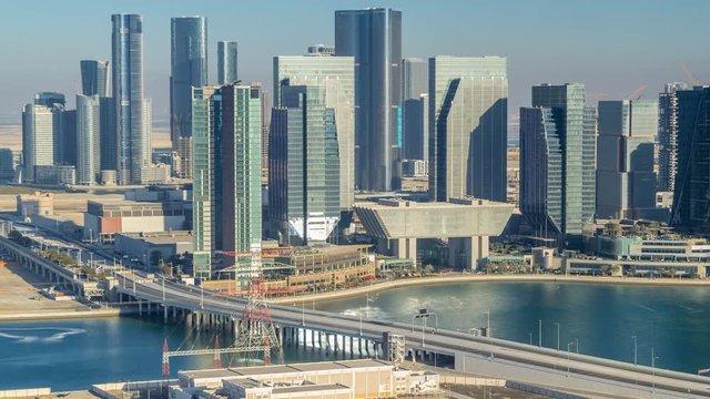 Aerial skyline of Abu Dhabi city centre from above timelapse