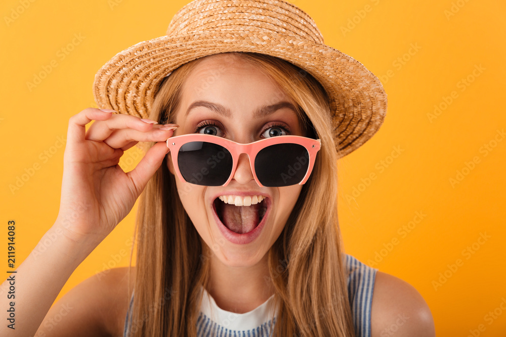 Wall mural Close up portrait of a cheerful young blonde woman