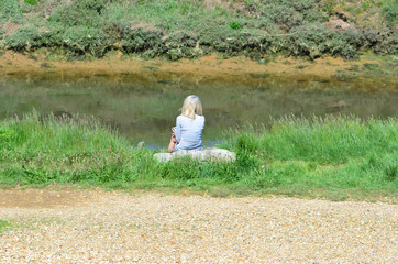 relaxing woman by the river