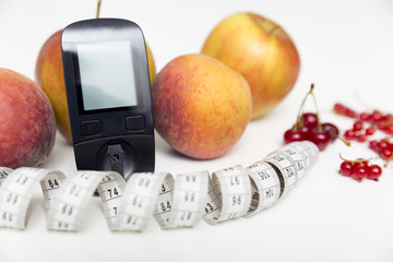 Diabetes monitor, diet and healthy food eating nutritional concept with clean fruits with diabetic...
