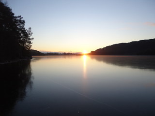 Fototapeta na wymiar Sunrise over the lake...Wolflake Norwey