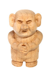Fototapeta na wymiar Figurine of a Troll carved from beech. Fairytale character. Front view. Old decorative toy. Isolated on a white