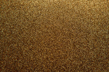 Sparkling and glittering gold background with a festive or party feel
