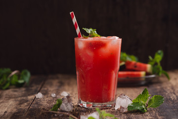 Refreshing summer watermelon juice in glasses with slices of watermelon