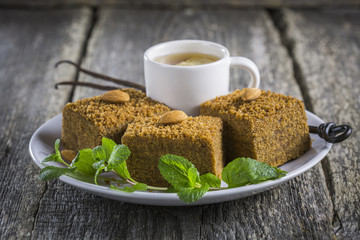 Vegan pie Medovik with almonds, vanilla and mint