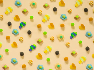 Jelly candies pattern on cream background