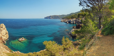 Beautiful landscape coastal promenade path between Deia and Soller villages in Majorca. Panoramic seascape scenery.