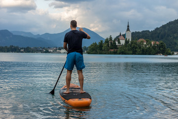 stand up paddle boarding on the lake