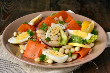 Salad with beans, egg, carrot and apple