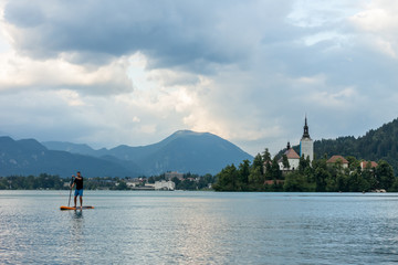 Fototapeta na wymiar stand up paddle boarding on the lake