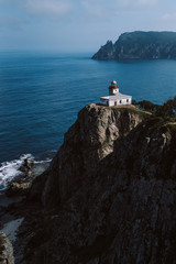 Fototapeta na wymiar Lighthouse on the rock