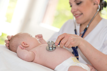 Baby examination with stethoscope