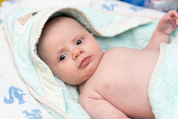Baby in hooded towel after bath