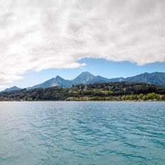 Turquoise water of Faaker See with Alps, Austria