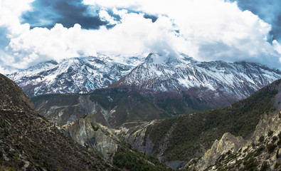 Fototapeta premium Mountain peaks in snow and clouds, Nepal.