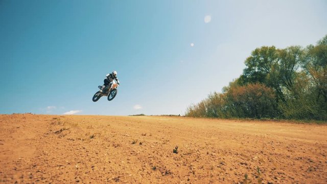 FMX rider finishes his flying performance in slow motion. Slow motion