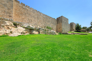 Fototapeta na wymiar Grass lawn near wall of old city Jerusalem