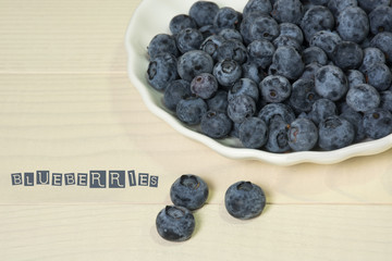 Blueberries summer berry on wooden table. Vitamin C, E, P, PP, B carotene flavonoids ascorbic acid. Organic fresh antioxidant food