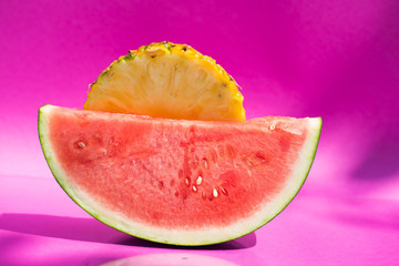 pineapple and watermelon on pink background