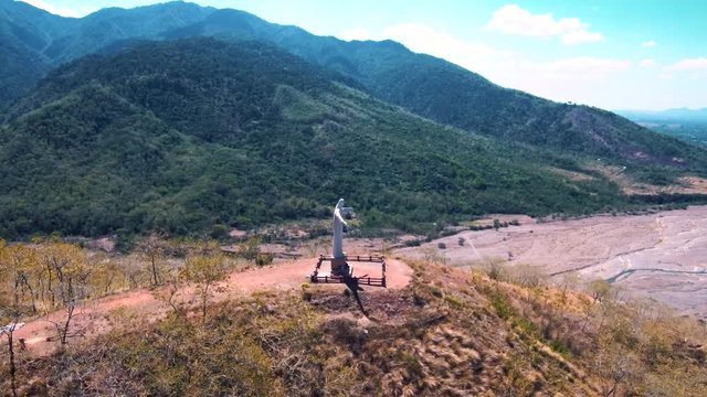 Aerial drone video of Christ the Redeemer on top a mountain in the Philippines, Asia.