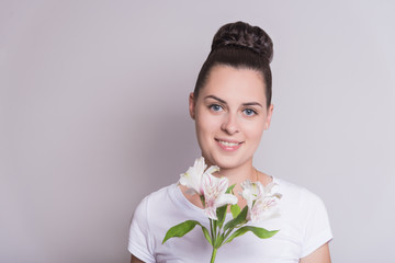 Woman with a flower. Woman on white background.