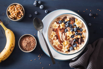 healthy banana smoothie bowl with blueberry chocolate walnuts