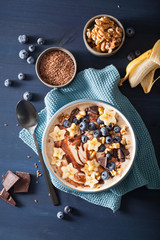 healthy banana smoothie bowl with blueberry chocolate walnuts