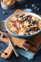 healthy banana smoothie bowl with blueberry chocolate walnuts